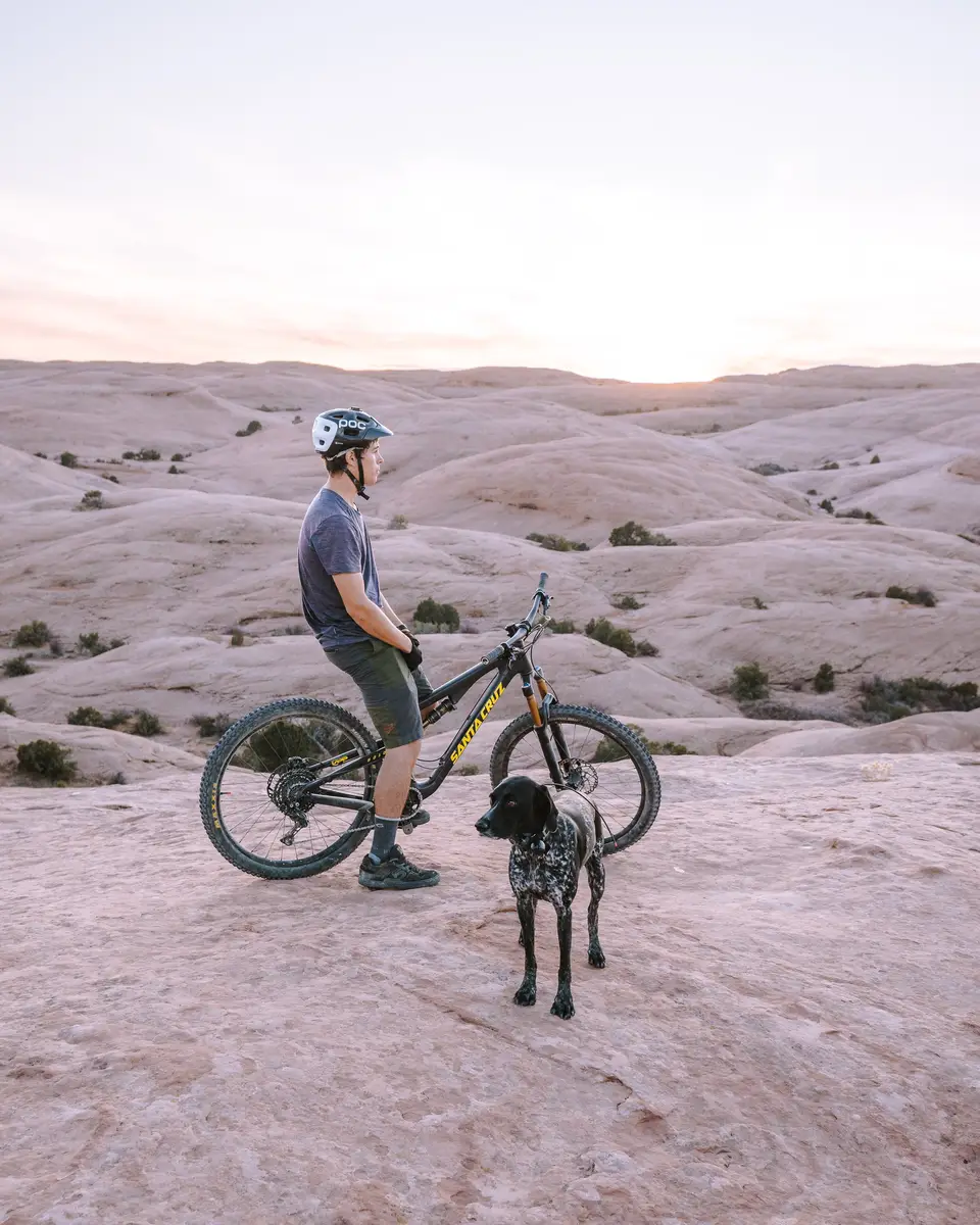 Evan and Penelope watching sunset on Slickrock Trail in Moab, Utah