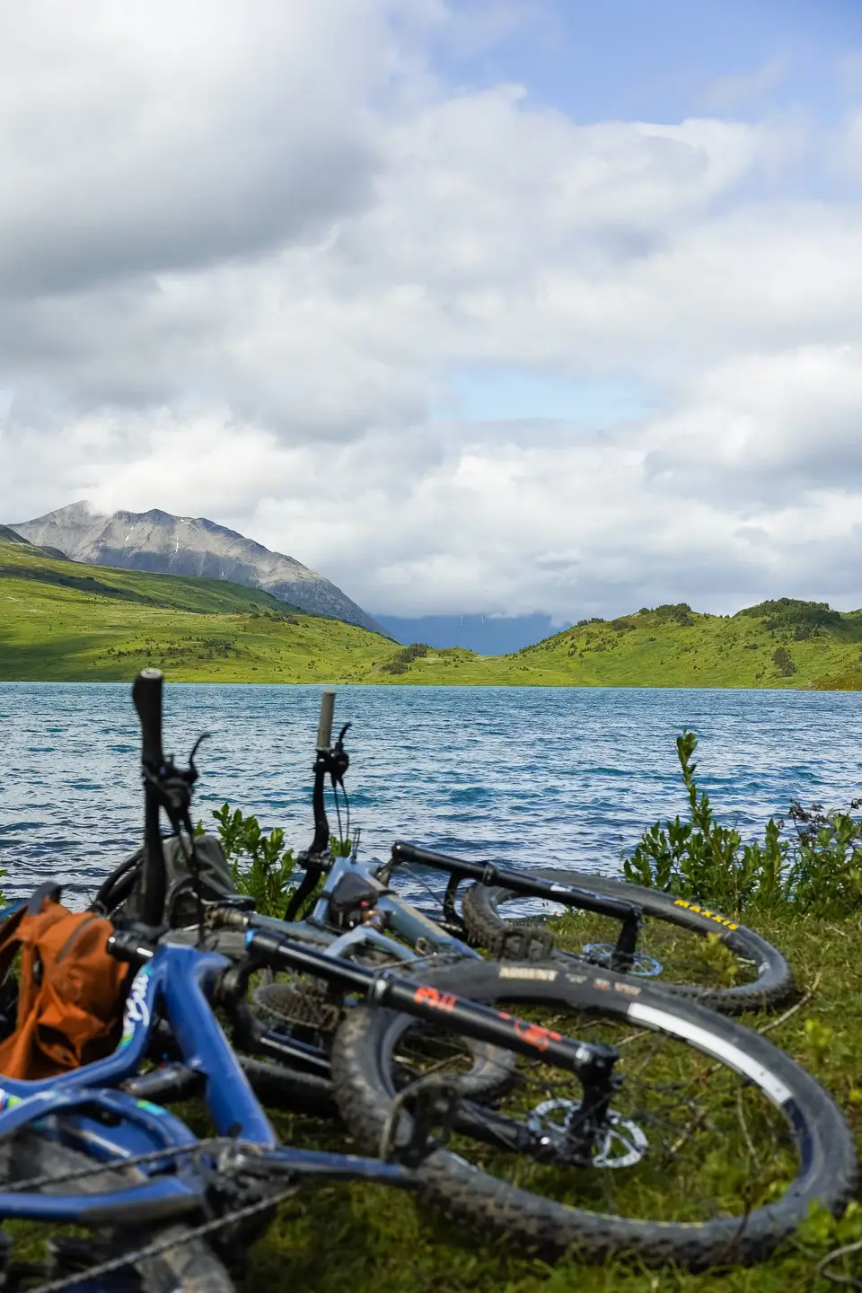 Two mountain bikes beside an alpine lake near Seward, Alaska