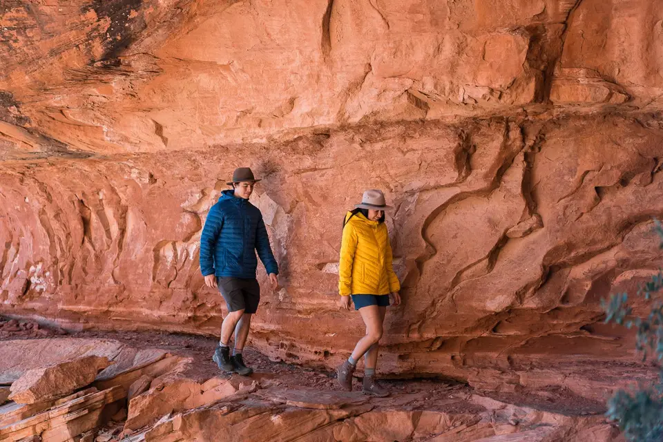 Evan and Melanny walking along canyon walls 
