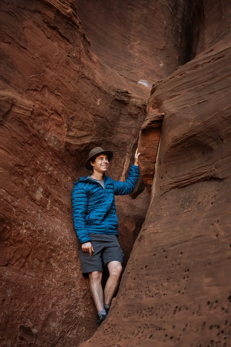 Evan leaning against canyon walls