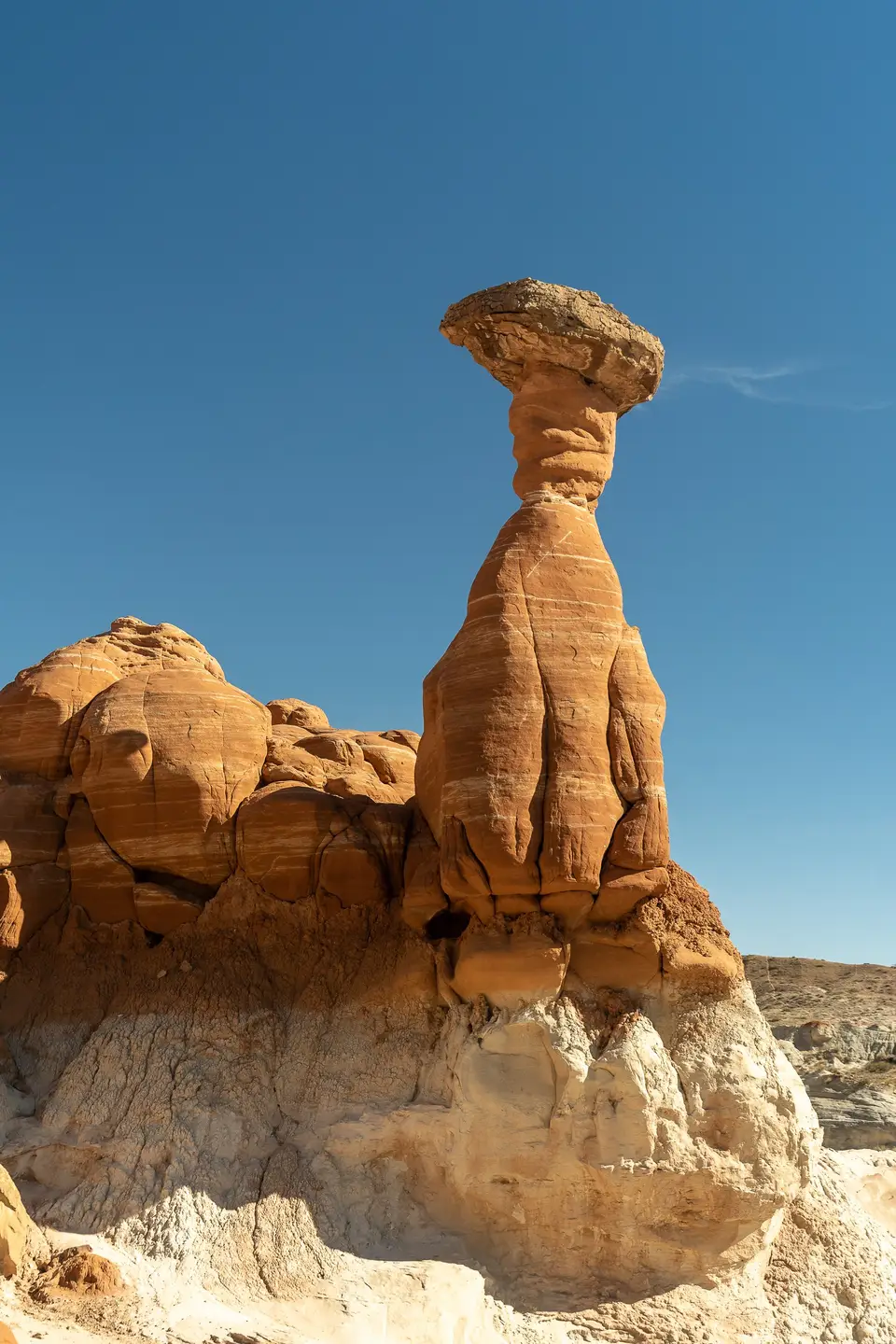 Standing below Toadstool Hoodoos in Southern Utah on blue bird day