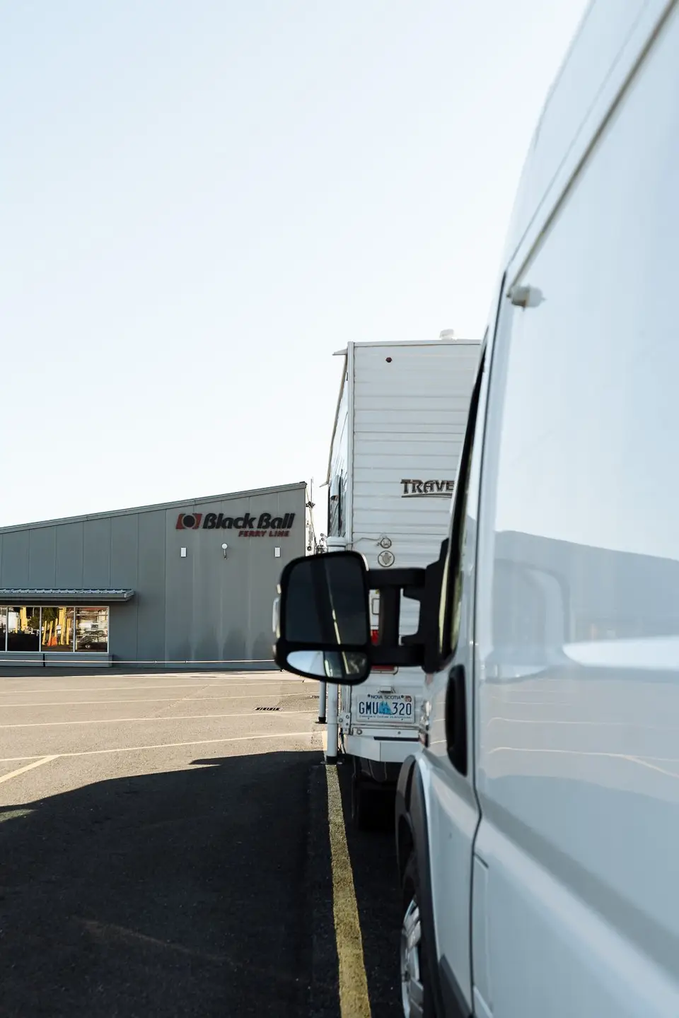 The Promaster parked beside a camper at the Black Ball Ferry Line terminal