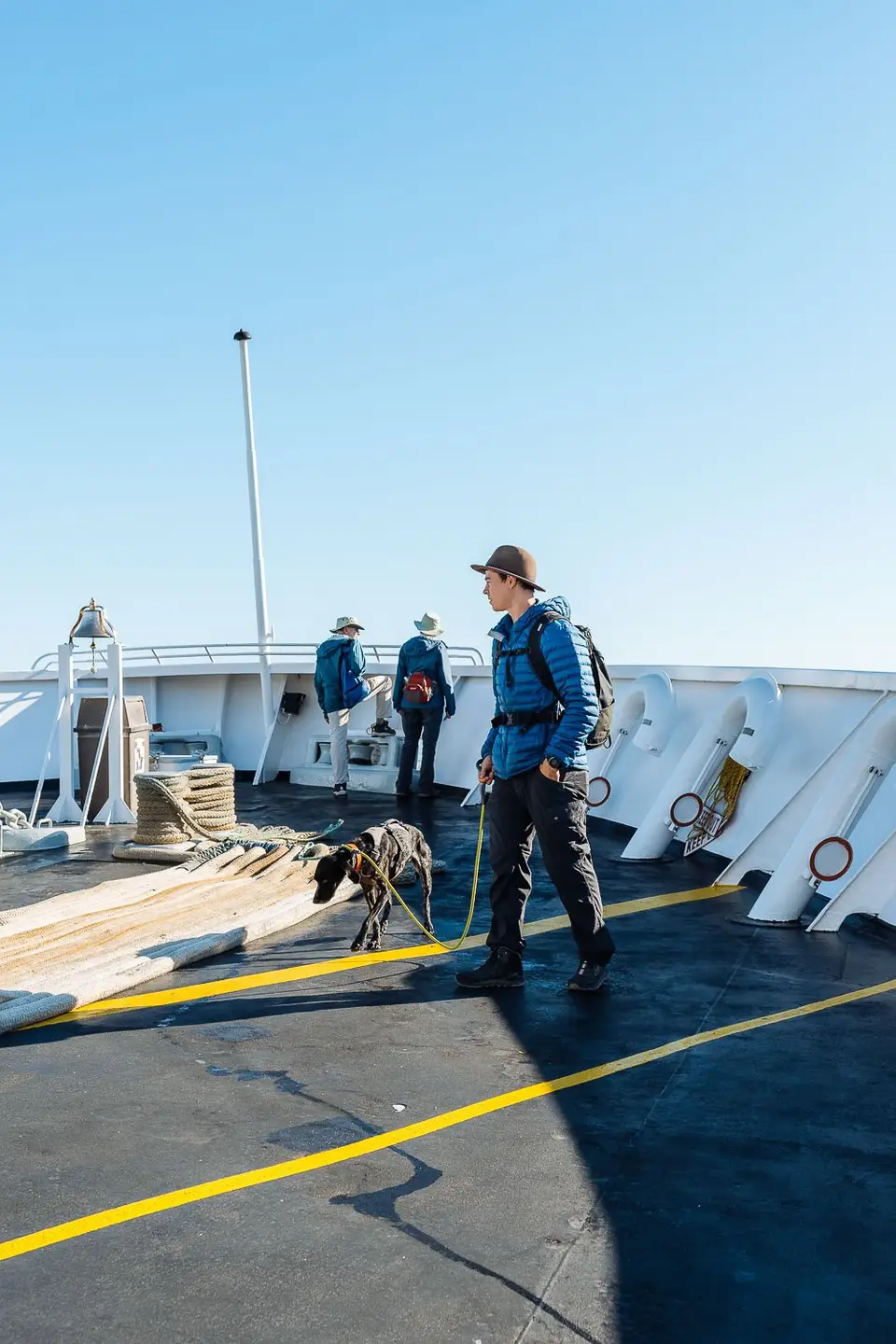 Evan walking Penelope across the ferry deck