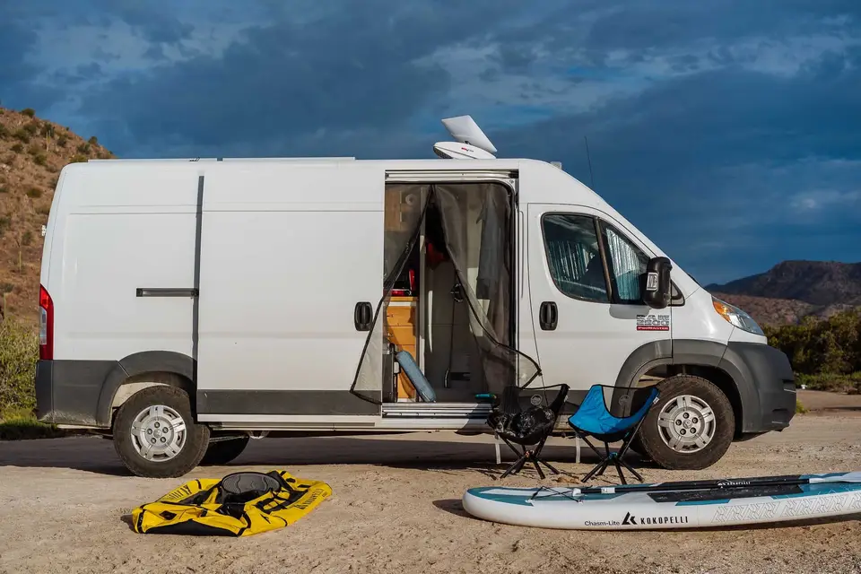 The Promaster parked at Bahía de Concepción with paddleboards out