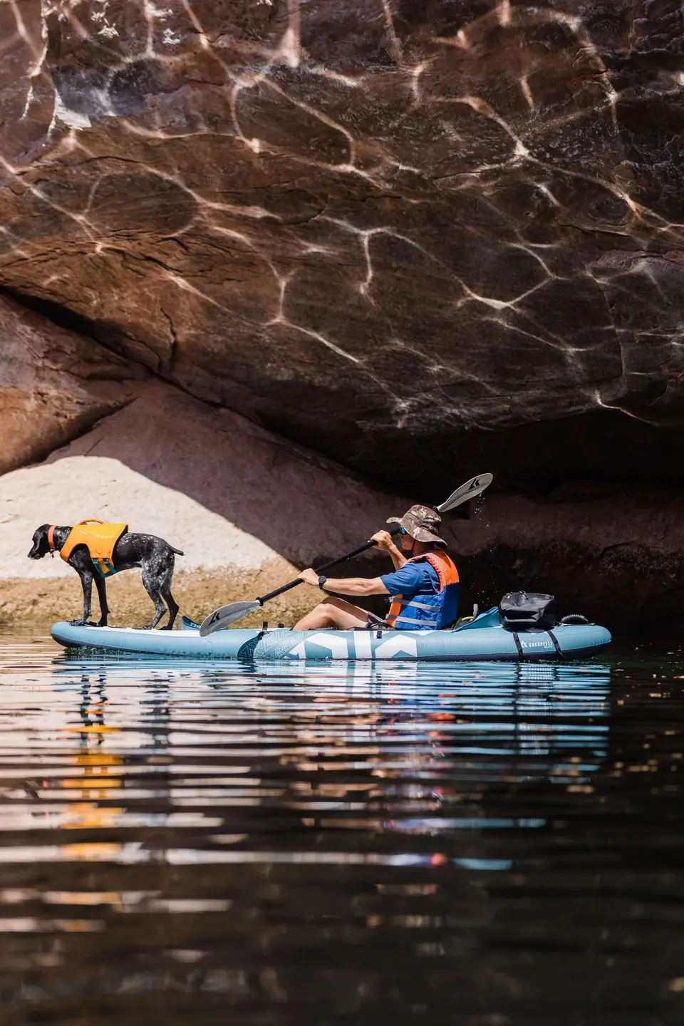 Light reflections on lake powell kayaking with dog