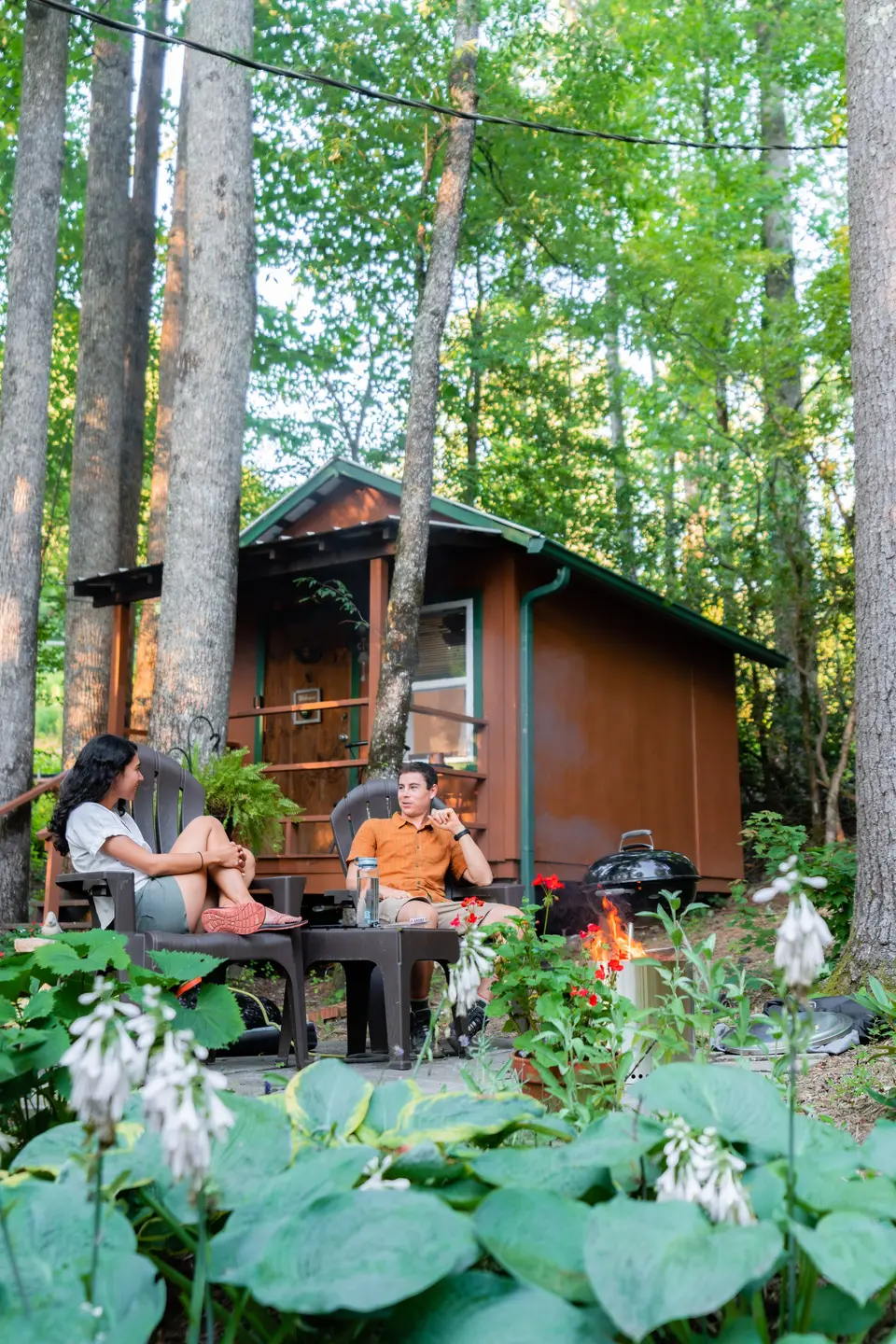 Campfire in front of a Hipcamp cabin in the woods