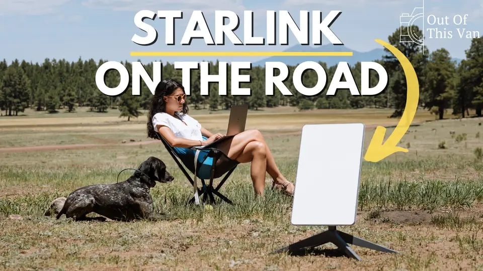 Melanny on a laptop in a meadow with Penelope and a Starlink dish